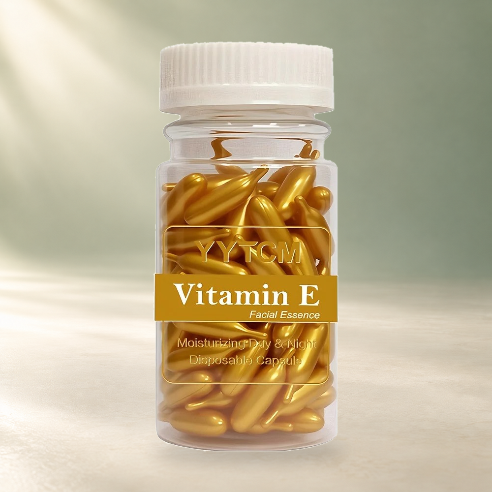 YYTCM Gold facial serum capsule bottle on a cream and sage background