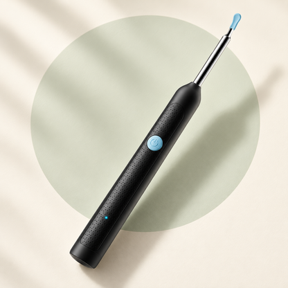 Black Y38 ear-camera device with blue fitted tip, blue power button and dotted handle on a cream and pale sage background