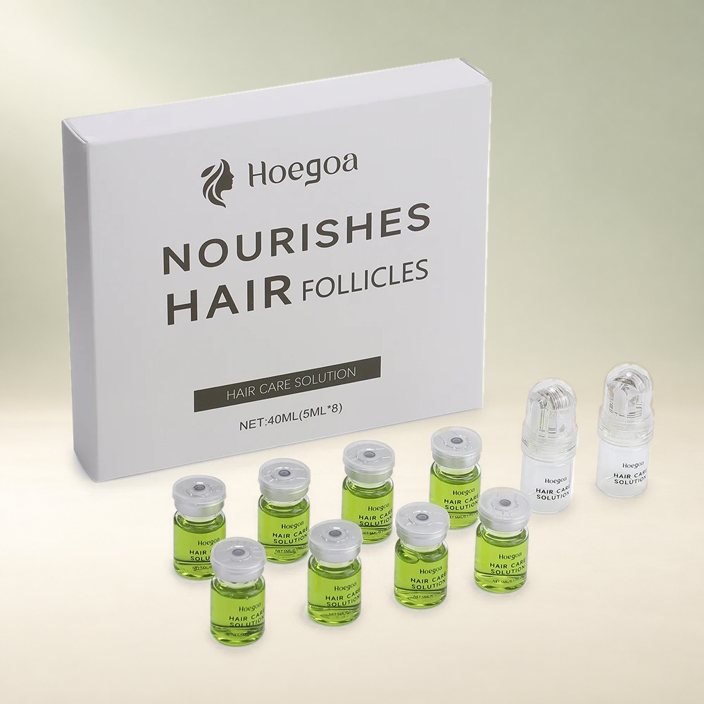 Hoegoa complete hair-care kit with eight 5 mL vials and two applicators on a cream and sage studio background